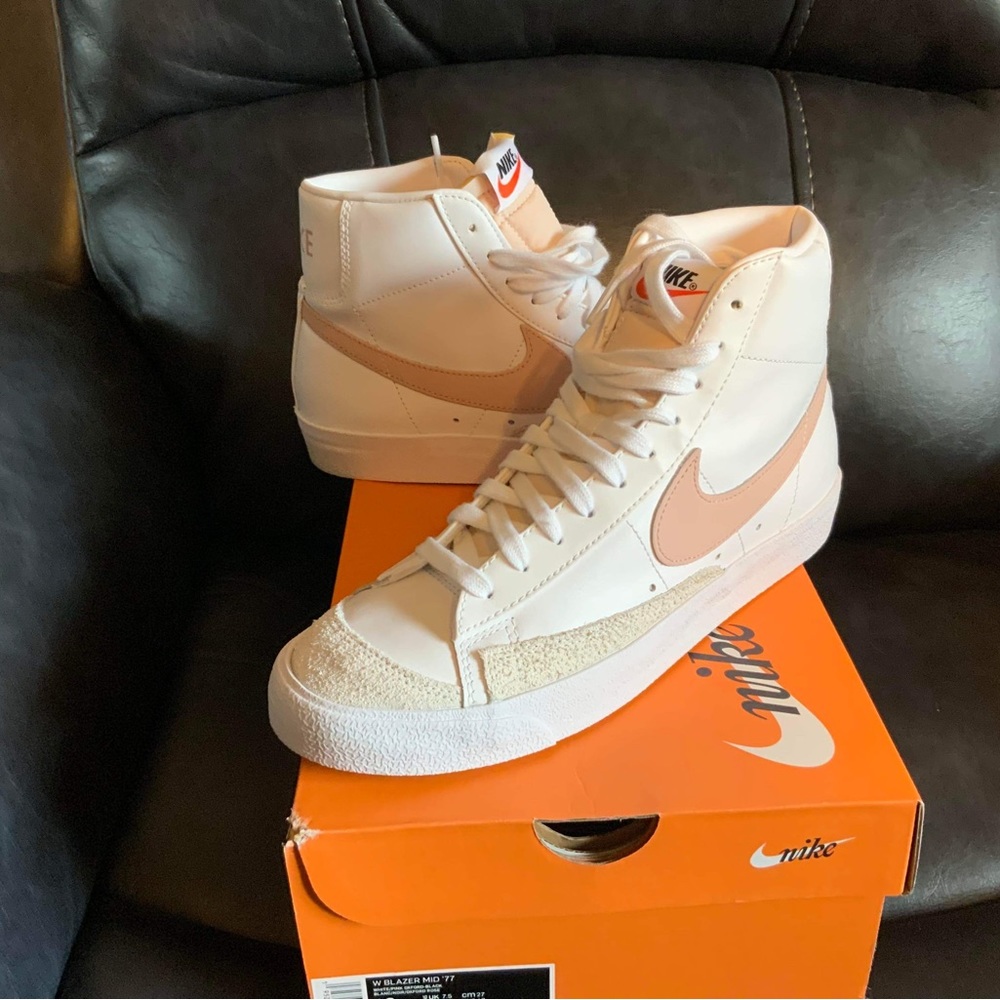 Pink and white Nike Blazers